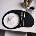 Black cashew shaped leather placemat Nordic velvet table mat with white tableware setup. - 44*30cm 115g/Piece / Black