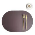 PU leather placemat and coaster set with golden cutlery, modern oval dining table mat decor. - Placemat 43.5x30cm & Coaster 10cm / Coffee & White