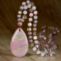 Handmade bohemian natural stone teardrop pendant necklace detail, brown cord beaded design. - Rhodonite with Black Lines