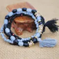 Pulsera de cuentas multicapa bohemia con cuentas negras grises y borlas para mujeres. - Negro