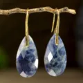 Faceted teardrop blue gemstone earrings with gold hooks, elegant vacation style jewelry piece. - Blue Sodalite
