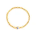 Vue détaillée d'un bracelet en perles dorées bohème avec un porte-bonheur œil bleu - Style Bleu Marine (JSS240029F)