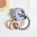 Set de mordedor de silicona gris y madera natural para el alivio de las encías del bebé - Dinosaurio Azul y Círculo