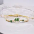 Bracciale bohémien intrecciato a mano in corda di canapa con sfera di vetro e fiore verde variante - 08 Verde