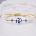 Bracciale intrecciato a mano in stile bohémien da donna con fiori secchi blu e perline. - Blu Reale