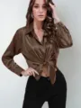 Brown satin long sleeve button-up shirt with front tie knot, elegant solid color top. - Camel