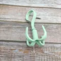 Four-claw rotating plastic clothes hook, multi-functional bag and tie storage hanger. - Nordic Green
