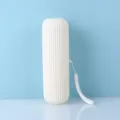 Portable travel plastic toothbrush cup with ribbed design and convenient lanyard white color variant - White