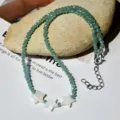 Collana di perline di cristallo verde con graziosi ciondoli a stella in conchiglia. - Stile Pendente Stella Cristallo Verde / Stile N2507