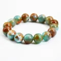 Bracciale con perle in finta giada da 12mm classico, design marmorizzato elegante. - Sfera da 12mm / Colore Giada Misto