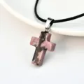 Pink crystal cross pendant necklace with black leather cord, versatile fashion jewelry for women. - Rhodonite