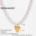 Gold plated stainless steel heart pendant necklace with white beaded design close up view - NXN444WH / White