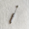 Rhinestone pearl beaded pen detail view, exquisite decorative writing tool for DIY crafts. - White