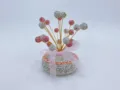 Rhinestone car ornament detail view featuring crystal baby's breath flower and pink ribbon bow. - Pink White