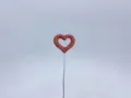 Detail shot of a sparkling rhinestone heart decoration on a metal wire, cute car accessory. - Pink Heart