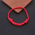 Detailed close-up shot of the handmade red nylon parachute cord bracelet with adjustable knots. - Braided Adjustable Style (BN-0279) / Watermelon red