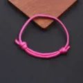 Closeup detail of the pink nylon paracord braided adjustable handmade bracelet, simple style. - Braided Adjustable Style (BN-0279) / Rose Red
