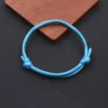 Close-up detail of the adjustable blue paracord handmade woven bracelet texture and knot. - Braided Adjustable Style (BN-0279) / Sky Blue