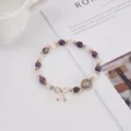 Close-up of beaded gemstone bracelet featuring amethyst, moonstone, quartz, and cute bow charm. - Purple White Premium Style