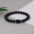 Close-up detail of the black matte agate beaded bracelet featuring a zodiac constellation charm. - Gemini Regular Style (BNS-0103) / Matte Stone