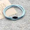 Light blue braided cord bracelet with black magnetic clasp, detailed view of jewelry accessory. - Double-Layer Magnetic Clasp Light Blue