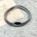 Grey woven rope bracelet featuring a secure black magnetic clasp. Detail close-up view. - Double-Layer Magnetic Clasp Gray