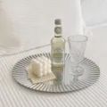 Nordic round stainless steel storage tray with vertical fluted edge, sleek mirrored vanity plate. - Vertical Striped Oval / Silver