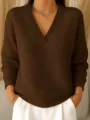 Waffle knit V-neck sweater detail, solid color long sleeve casual top closeup view. - Coffee