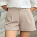 High-waisted pleated casual shorts detail, relaxed fit, stylish cuffed hem design. - Apricot