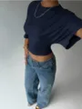Detail view of the elegant dark blue slim-fit short sleeve top, stylish casual summer wear. - Navy Blue