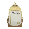 Nahaufnahme eines stylischen, farbblockierten Studentenrucksacks mit praktischer Fronttasche. - Groß (Ohne Anhänger) / Gelb