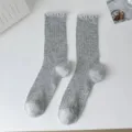 Grey knit mid-calf socks with delicate lace ruffle trim for women, comfortable daily wear. - Light Gray