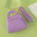 Cute purple leather mini handbag keychain coin purse with gold hardware and wrist strap. - Purple