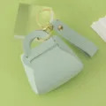 Mint green leather mini handbag keychain with gold hardware and stylish strap charm. - Mint Green