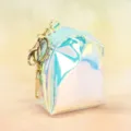 Holographic mini backpack keychain coin purse detail showing glossy PVC and golden keyring. - Plain Style / Green
