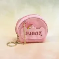 Pink mini semi-circular PVC coin purse with keychain, cute cartoon charm and letter cutout. - Pink