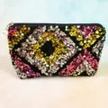 Sequin cosmetic bag with zipper and pearl pendant, fashionable trapezoid makeup storage pouch. - Milky White