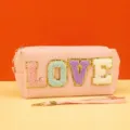 Pink cosmetic pouch detail view with cute LOVE letter embroidery and handy wrist strap. - love Series / 18X7X9CM / Love Lotus Color