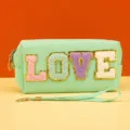 Detailed view of the mint green cosmetic bag featuring fuzzy glitter LOVE letter patch. - love Series / 18X7X9CM / Love Light Green