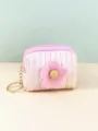 Closeup detail of the cute pink gradient mini coin purse with fluffy flower and keychain. - Pink