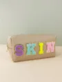 Close up detail of large capacity PU leather cosmetic bag with colorful chenille patches. - Camel (SKIN)