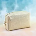 Detailed close-up of a sparkling gold cosmetic pouch with a chic pearl zipper pull charm. - Solid Color / 18x7x11cm / Champagne