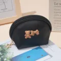 Cute black semi-circular coin purse featuring a 3D bear and bow, detailed shot. - 14X7X10 / Black
