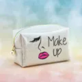 Glitter cosmetic bag for women, sparkly makeup pouch with pearl zipper and cute lips graphic. - Face Portrait Print / 18x7x11cm / Cream