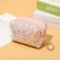 Pink sequin mini coin purse with zipper closure and cute keychain for daily use and portable storage. - Pink