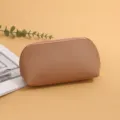 Solid color PU leather cosmetic bag, portable shell shaped makeup storage pouch in brown. - L / Khaki
