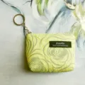 Detailed shot of yellow textured mini coin purse with keychain and zipper closure, compact design. - 12*2.5*8.5CM / Lemon Yellow