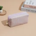 Purple tweed cosmetic bag with pearl zipper pull, stylish storage pouch for travel daily. - Purple