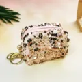 Detailed view of the pink sequin mini coin purse, trendy lipstick and coin storage bag. - Lotus Pink