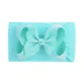 Close-up of vibrant cyan soft nylon headband with large grosgrain ribbon bow - Cyan Blue